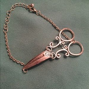 Silver-plated vintage look scissors bracelet.